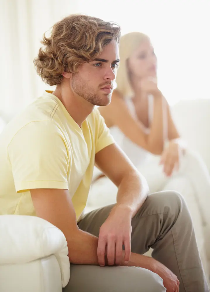 Angry-couple-fight-and-divorce-stress-on-a-sofa - Finding Peace Counseling Service PLLC Angry couple, fight and divorce stress on a sofa with argument