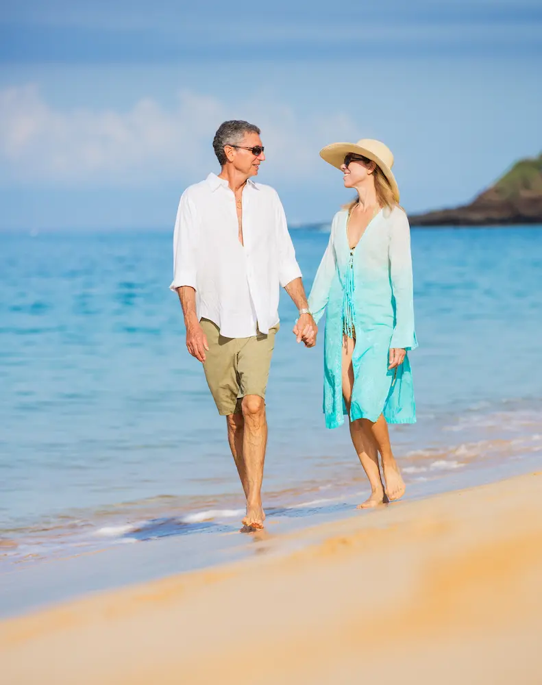 Couple-Enjoying-Walk-on-the-Beach - Finding Peace Counseling Service PLLC Middle Aged Couple Enjoying Walk on the Beach