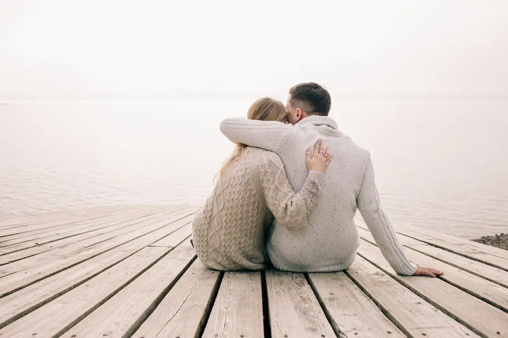 couple-hugging-on-a-pier- - Finding Peace Counseling Service PLLC couple hugging on a pier