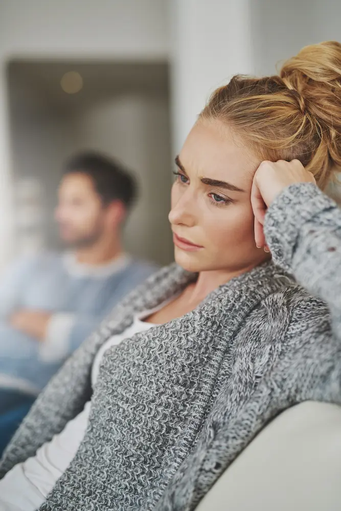 depression-and-woman-in-conflict-with-her-boyfriend- - Finding Peace Counseling Service PLLC Sad, depression and woman in conflict with her boyfriend in the living room of their apartment.